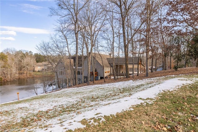 view of front of house with a water view