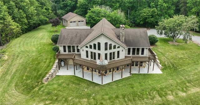 4933 W NC Highway 268, Wilkesboro, NC 28697 - rear view of property with a deck, a yard, a chimney, and a patio area