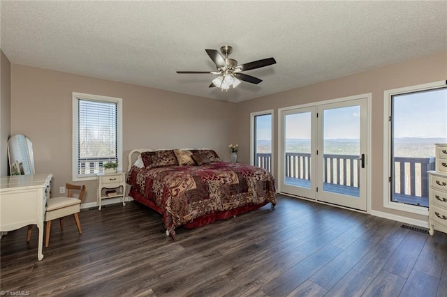 4933 W NC Highway 268, Wilkesboro, NC 28697 - bedroom featuring dark wood-style floors, access to exterior, a textured ceiling, baseboards, and ceiling fan