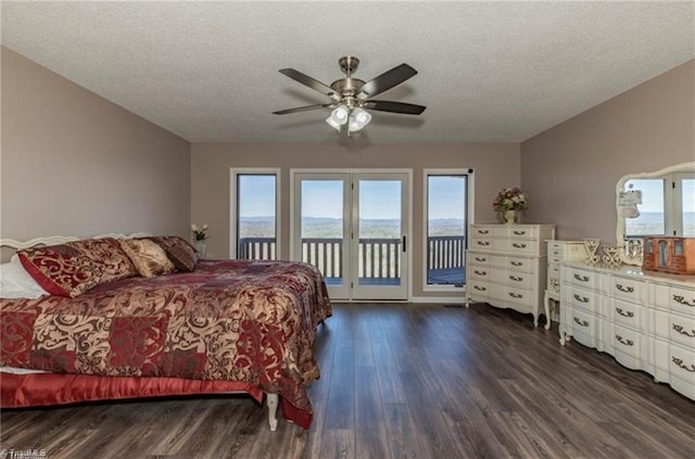 4933 W NC Highway 268, Wilkesboro, NC 28697 - bedroom featuring access to exterior, dark wood-style floors, a textured ceiling, and ceiling fan