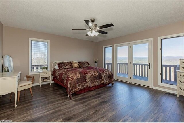 4933 W NC Highway 268, Wilkesboro, NC 28697 - bedroom with dark wood-style floors, access to outside, a textured ceiling, baseboards, and a ceiling fan