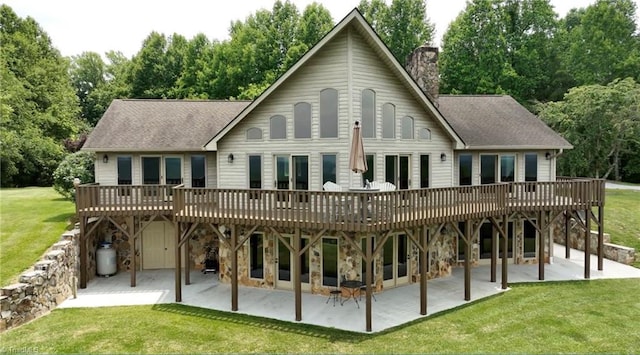 4933 W NC Highway 268, Wilkesboro, NC 28697 - back of property featuring a wooden deck, a patio, a chimney, and a yard