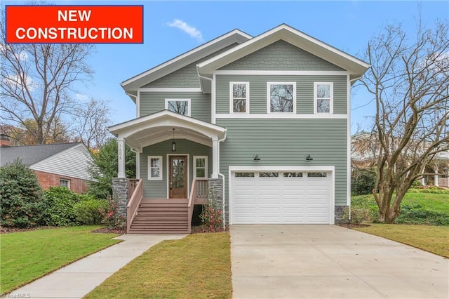 craftsman inspired home featuring covered porch, concrete driveway, a front lawn, and a garage