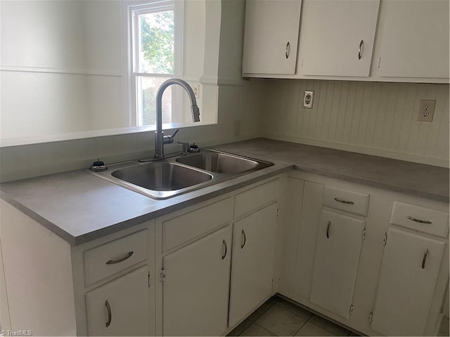 630 Liberty Rd, High Point, NC 27263 - kitchen with white cabinets and light tile patterned flooring