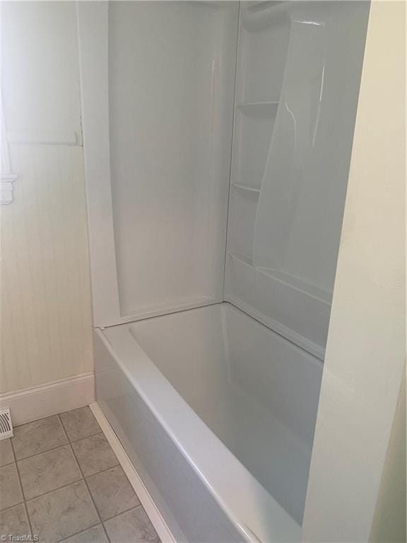630 Liberty Rd, High Point, NC 27263 - full bathroom featuring tile patterned floors and washtub / shower combination