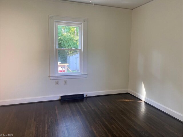 630 Liberty Rd, High Point, NC 27263 - unfurnished room with dark wood-style flooring and baseboards