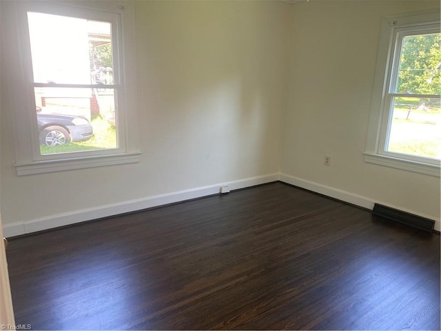 630 Liberty Rd, High Point, NC 27263 - empty room with dark wood finished floors and baseboards