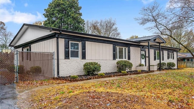 view of side of property with a lawn