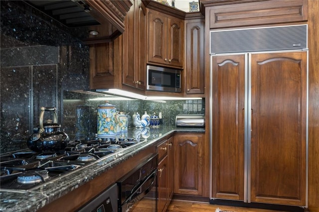 6 Curtis Ct, Thomasville, NC 27360 - kitchen with stainless steel appliances, decorative backsplash, and dark stone countertops