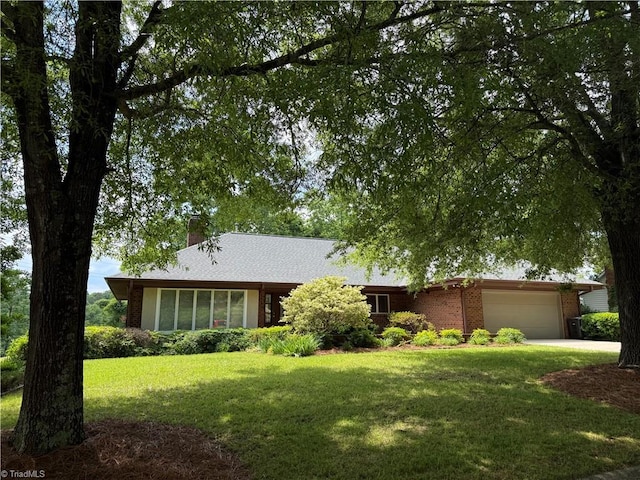 1223 Gatehouse Rd, High Point, NC 27262 - ranch-style home with an attached garage, a chimney, a front lawn, brick siding, and concrete driveway