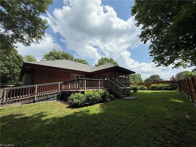 1223 Gatehouse Rd, High Point, NC 27262 - back of property with a sunroom, a deck, and brick siding