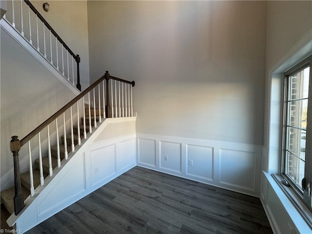 stairs featuring wood-type flooring