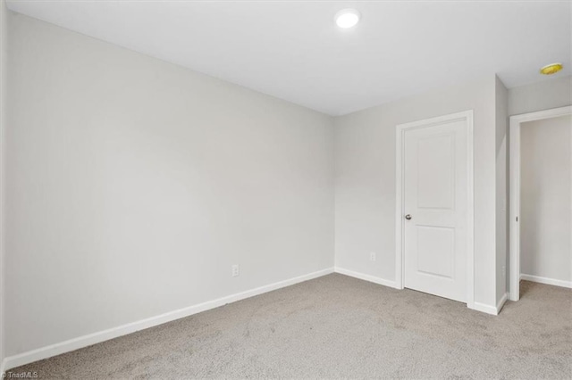 empty room with light colored carpet