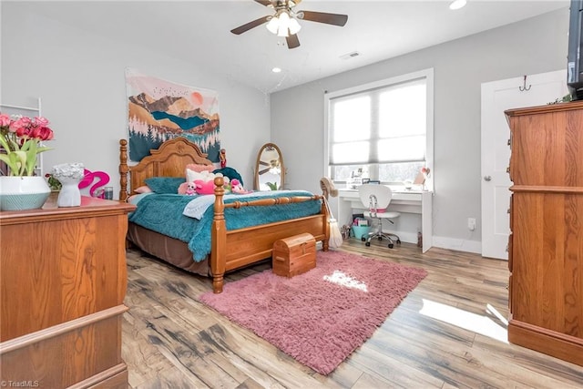 bedroom featuring ceiling fan and light hardwood / wood-style floors