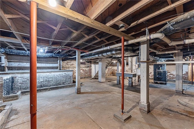 unfinished basement with stairway and heating unit