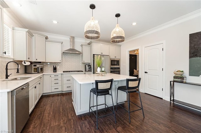 111 Park Place Cir, Winston-Salem, NC 27107 - kitchen with wall chimney range hood, stainless steel appliances, a sink, light countertops, and crown molding