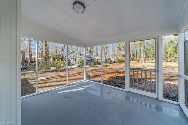 unfurnished sunroom featuring a healthy amount of sunlight