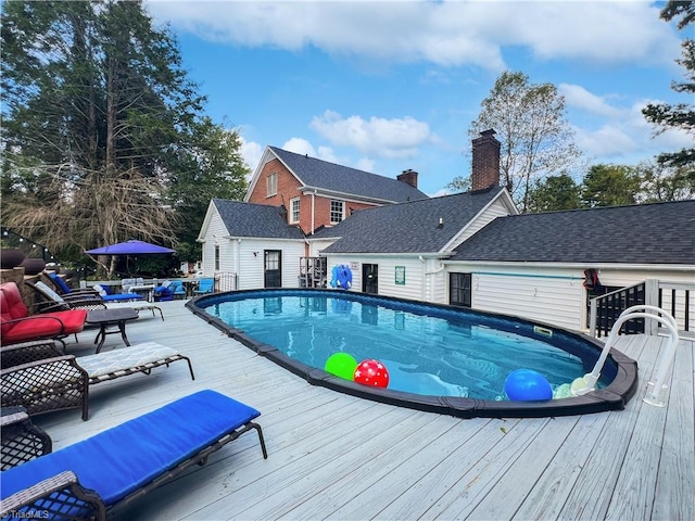 pool featuring a wooden deck