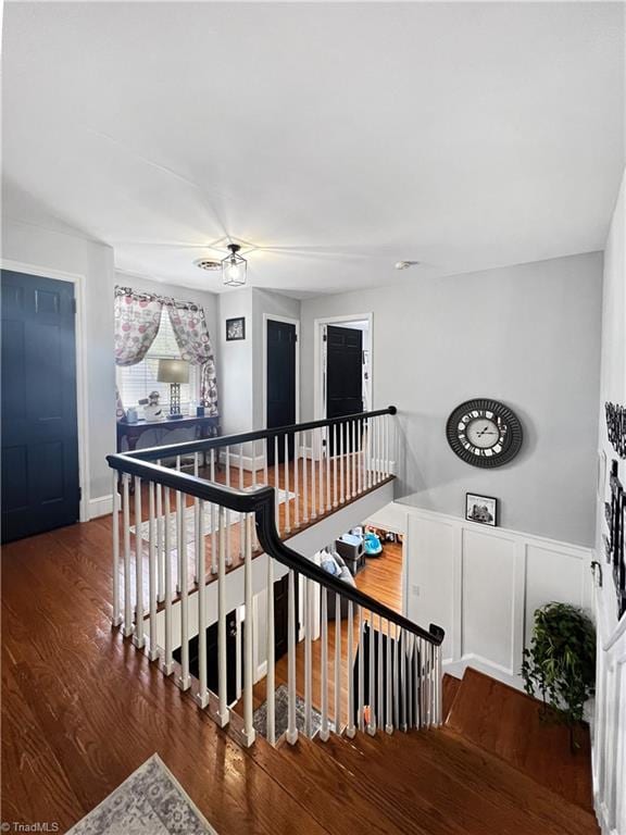 staircase with wood finished floors