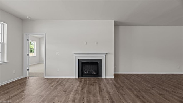 3822 Colt Ct, Trinity, NC 27370 - unfurnished living room with wood finished floors, a fireplace, and baseboards