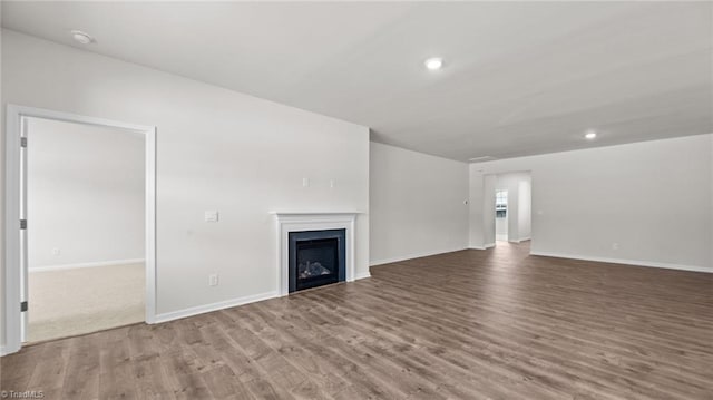3822 Colt Ct, Trinity, NC 27370 - unfurnished living room featuring wood finished floors, a fireplace, baseboards, and recessed lighting