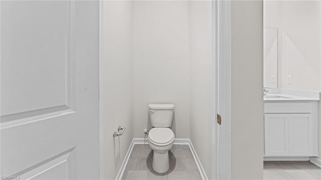 3822 Colt Ct, Trinity, NC 27370 - bathroom featuring toilet, vanity, baseboards, and tile patterned flooring