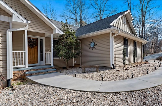 property entrance featuring covered porch