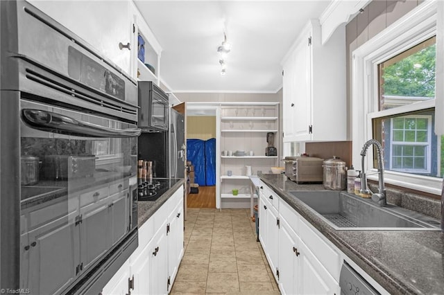 365 Ransom Rd, Winston-Salem, NC 27106 - kitchen featuring a sink, dark countertops, black appliances, and white cabinets