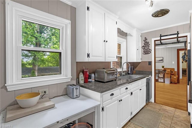 365 Ransom Rd, Winston-Salem, NC 27106 - kitchen featuring a sink, white cabinetry, crown molding, and dishwasher