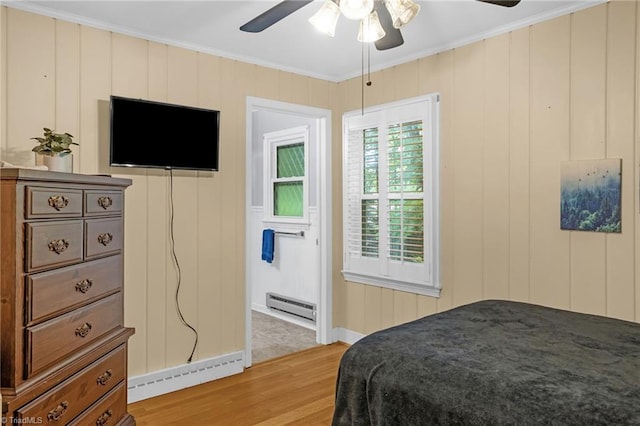 365 Ransom Rd, Winston-Salem, NC 27106 - bedroom with a baseboard heating unit, light wood-type flooring, ornamental molding, baseboards, and a ceiling fan