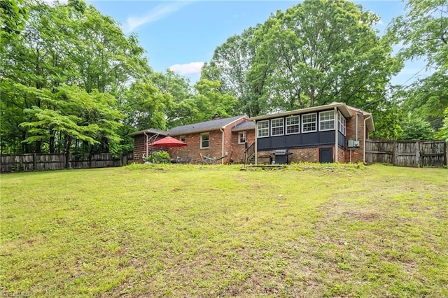 365 Ransom Rd, Winston-Salem, NC 27106 - rear view of house with a sunroom and brick siding