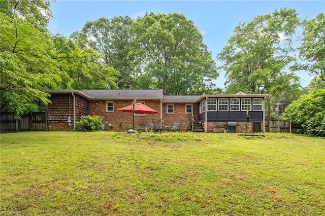 365 Ransom Rd, Winston-Salem, NC 27106 - back of house featuring a sunroom, a chimney, and brick siding