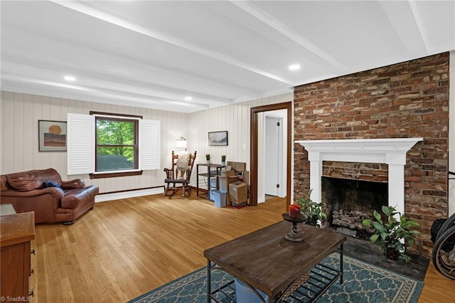 365 Ransom Rd, Winston-Salem, NC 27106 - living area with wood finished floors, beamed ceiling, a baseboard heating unit, and a fireplace