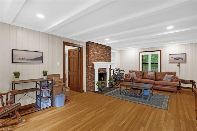 365 Ransom Rd, Winston-Salem, NC 27106 - living room with wood finished floors, beamed ceiling, and a brick fireplace