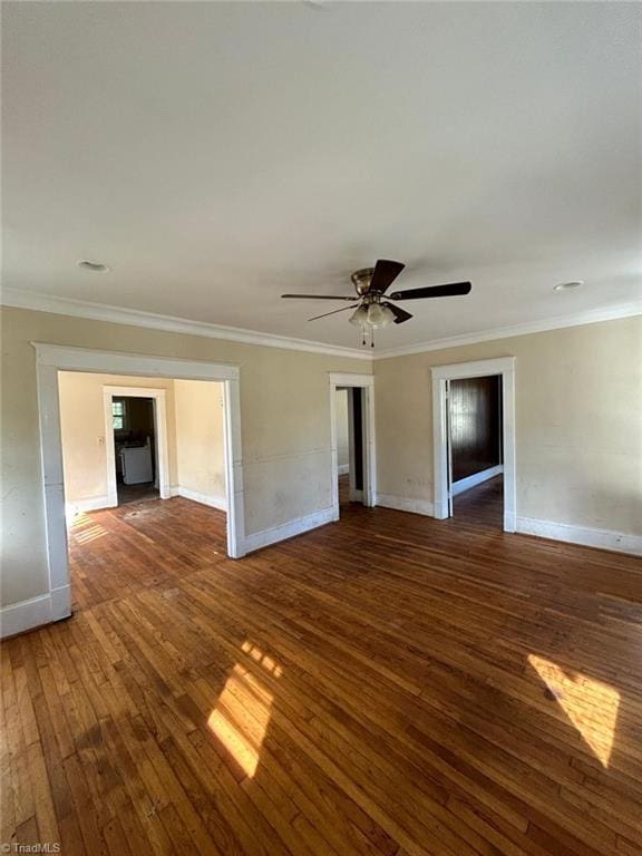 unfurnished room featuring ceiling fan, ornamental molding, and dark hardwood / wood-style flooring