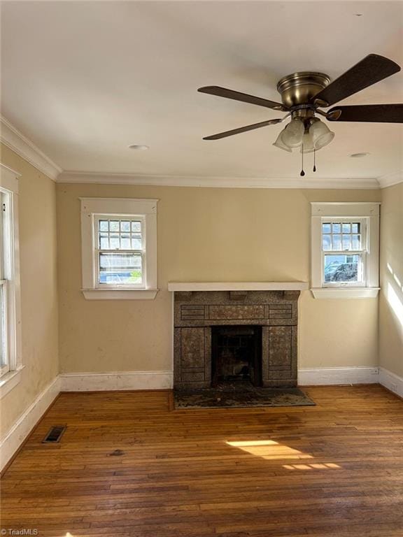 unfurnished living room with ornamental molding, hardwood / wood-style floors, and ceiling fan