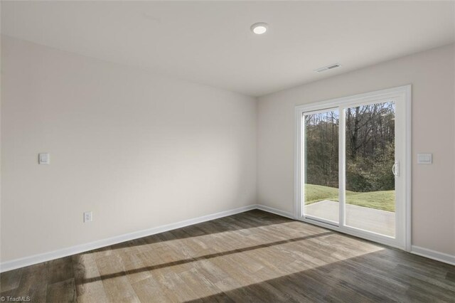 152 E Farm Loop, Stokesdale, NC 27537 - unfurnished room with visible vents, baseboards, and wood finished floors