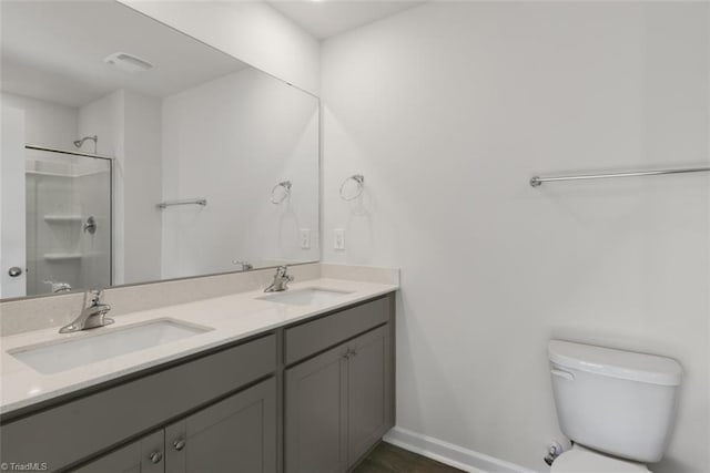 152 E Farm Loop, Stokesdale, NC 27537 - full bath with double vanity, toilet, walk in shower, and a sink