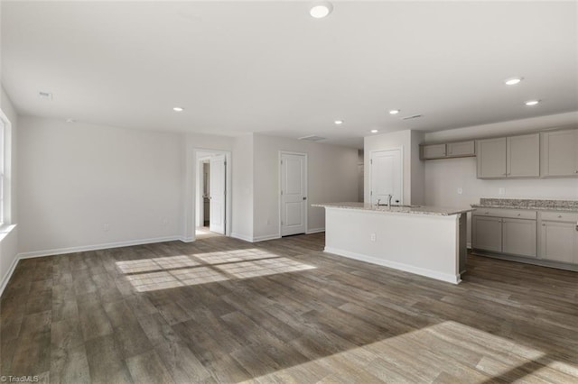 152 E Farm Loop, Stokesdale, NC 27537 - unfurnished living room featuring dark wood-type flooring, recessed lighting, and baseboards