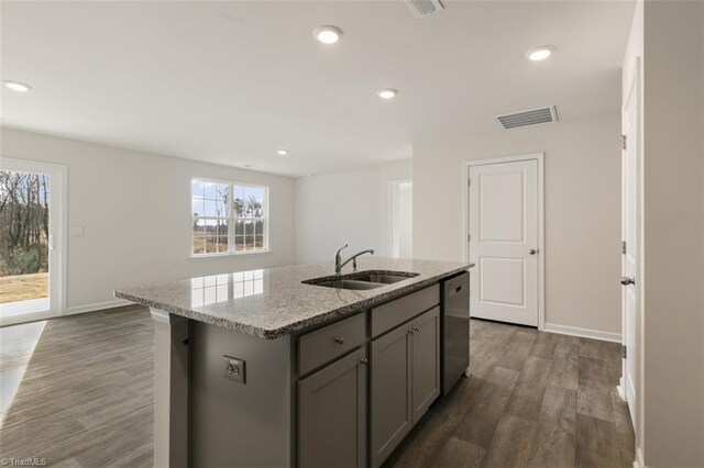 152 E Farm Loop, Stokesdale, NC 27537 - kitchen with visible vents, an island with sink, gray cabinets, a sink, and dishwasher