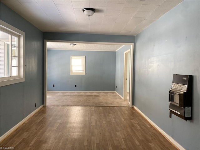 hallway with hardwood / wood-style floors