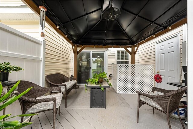 wooden deck with a gazebo