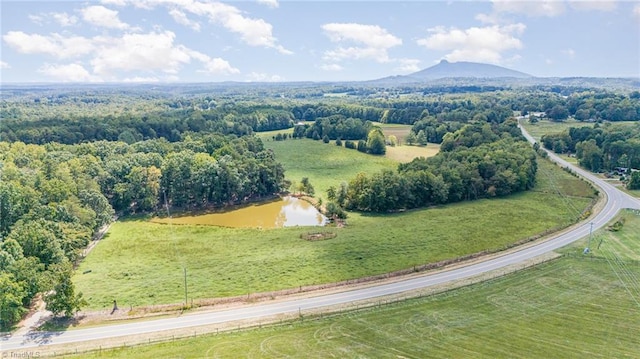 bird's eye view with a water and mountain view and a rural view