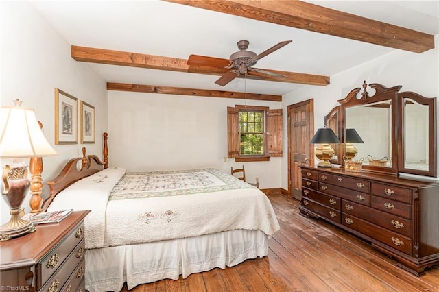 bedroom with hardwood / wood-style flooring, baseboards, a ceiling fan, and beamed ceiling