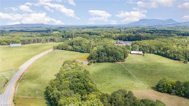 aerial view featuring a rural view, a forest view, and a mountain view