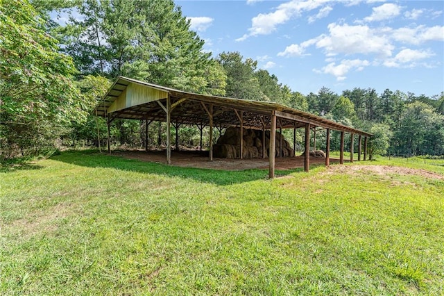 exterior space with a yard and a detached carport