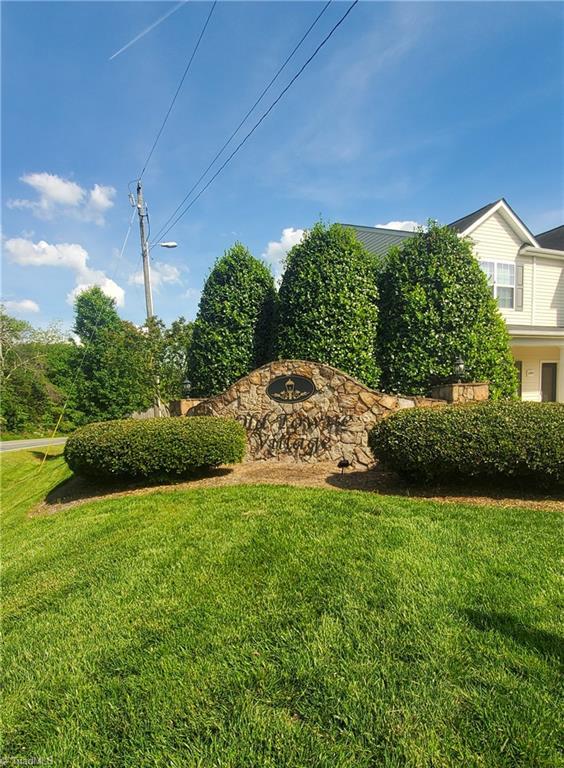 4881 Old Towne Village Cir, Pfafftown, NC 27040 - community sign with a yard