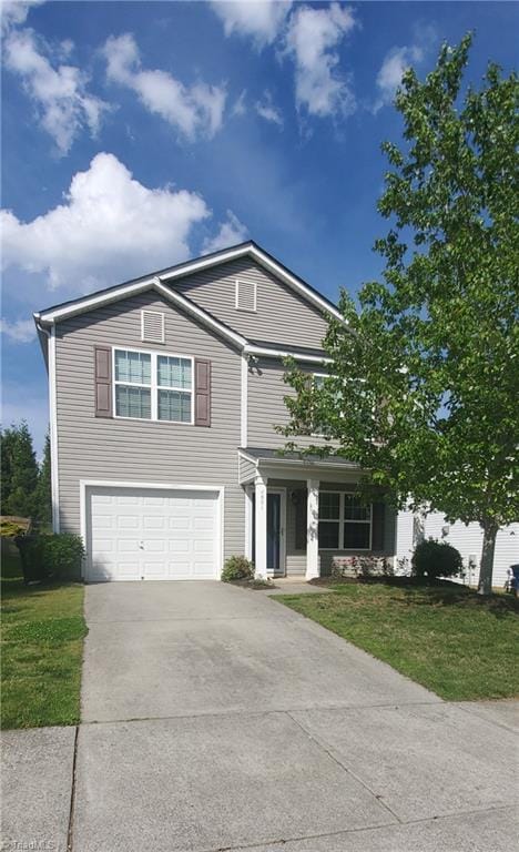 4881 Old Towne Village Cir, Pfafftown, NC 27040 - traditional-style home with an attached garage, driveway, and a front yard