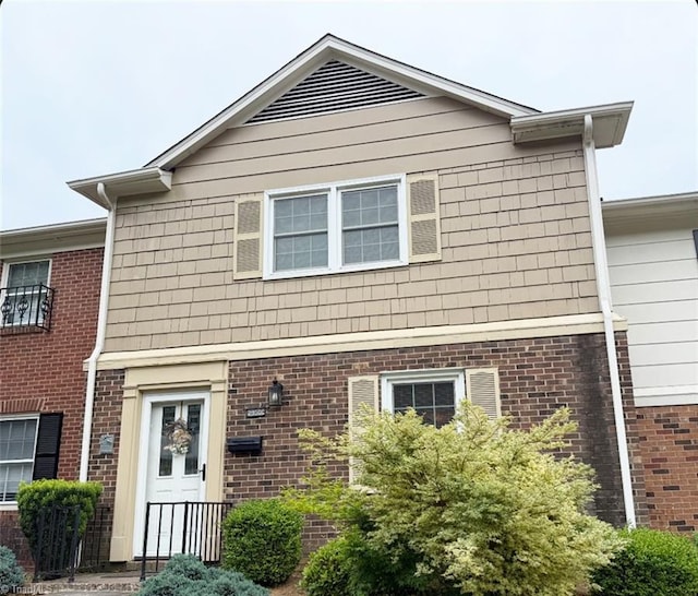 view of front of home with brick siding