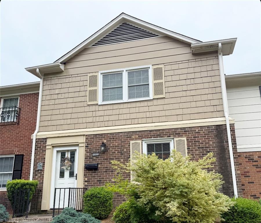 view of front of home with brick siding